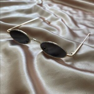 Elegant Gold and Black Oval Sunglasses